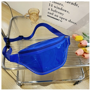 Detail view of transparent blue PVC fanny pack with matching strap on metal grid cart