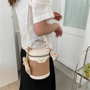 Vintage cylinder bucket bag with crocodile texture and silk scarf handle decor