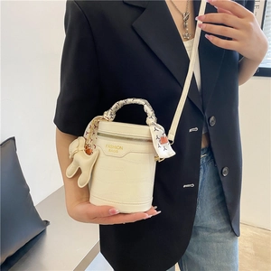 Retro crocodile pattern bucket bag in cream white with a silk scarf handle and rabbit charm