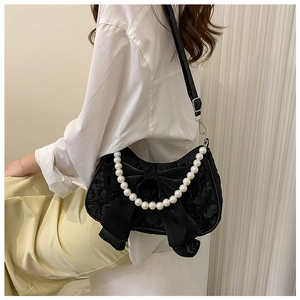 Chic black lace shoulder bag with a large satin bow and decorative pearl chain handle