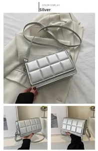 Detailed view of silver quilted crossbody bag with metallic faux leather and adjustable strap