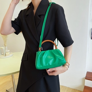 Chic lime green pleated cloud bag with wooden handles and crossbody strap