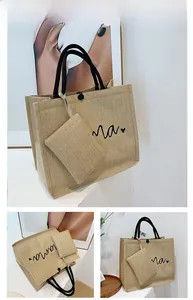 Multi-angle view of linen tote bag with 'mama' print and small hanging utility pouch