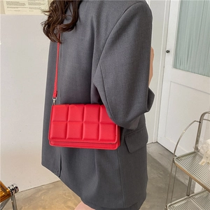 Classic red quilted crossbody bag for women with 3D plaid texture and long strap