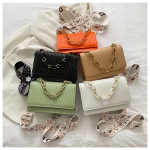 Detailed top view of five pleated crossbody bags with chic bohemian embroidery straps