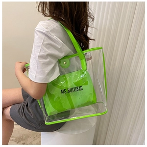 Detail of neon green inner pouch and transparent PVC tote bag with MS.HUIXIBAG logo
