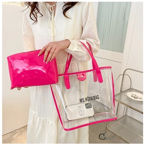 Detail of rose red transparent PVC tote bag and matching inner leather pouch set