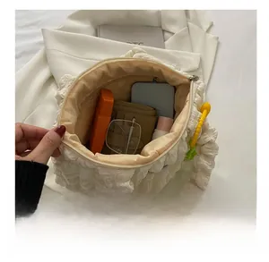 Detailed internal view showing large capacity and zipper pocket of creamy bubble bag