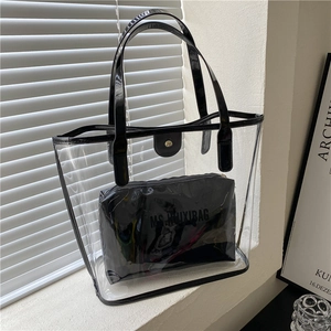 Minimalist clear PVC tote bag with black patent leather trim and inner pouch