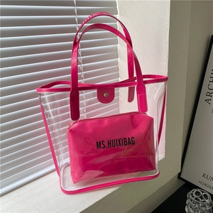 Large transparent PVC tote bag with magenta trim and matching inner zipper pouch