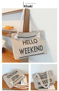 Detail of khaki canvas tote bag with HELLO WEEKEND print and thick rope handles