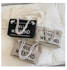 Three canvas tote bags in black, white, and khaki with HELLO WEEKEND text and rope handles