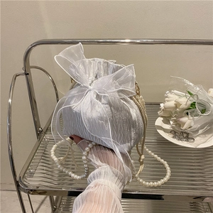 White pleated bucket bag with large organza bow and pearl shoulder strap for women