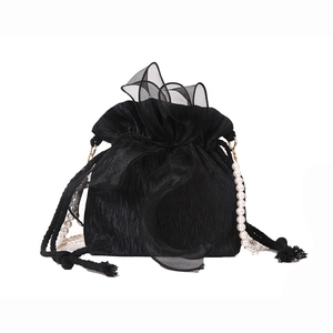 Elegant black pleated drawstring bucket bag featuring a pearl strap and organza bow detail
