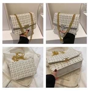 Detail of white tweed crossbody bag showing gold twist lock and woven chain strap