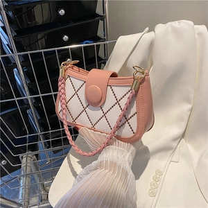 Pink and white quilted faux leather underarm bag with woven handle and gold hardware