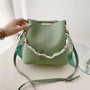 Avocado green bucket bag with floral scarf handle and adjustable strap for women