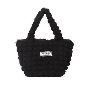 Minimalist black bubble fabric tote bag with Fashion Instinct label and zipper closure