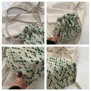 Detailed views of a green and cream woven drawstring bucket bag with cord straps
