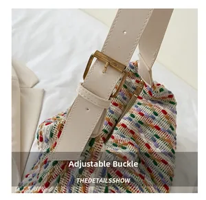 Detail of adjustable gold buckle and multi-color tweed woven texture on large tote bag