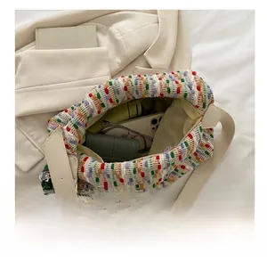 Detail view of large multi-color tweed tote bag showing spacious interior capacity