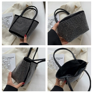 Detail views of black bucket bag with sparkling silver rhinestones and zipper closure