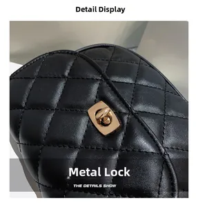 Close-up of golden hardware swivel lock on black quilted leather rhombic handbag