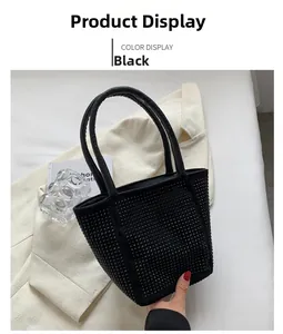 Detailed view of black rhinestone bucket bag with sparkling studs and cylindrical handles