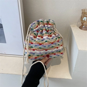 Colorful woven drawstring bucket bag with textured cotton straps for casual daily wear