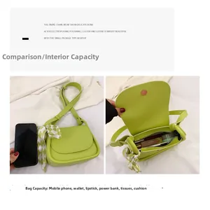 Detail view of green shoulder bag capacity with scarf decoration and size comparison