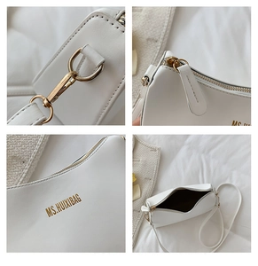 Detail view of white PU leather handbag featuring gold-tone hardware and brand logo