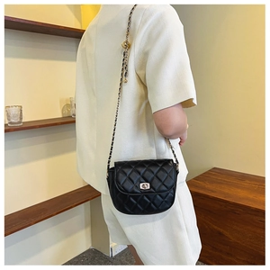 Classic black quilted crossbody bag with metal chain strap and turn-lock closure detail