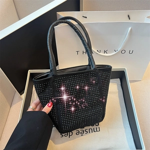 Chic black water bucket tote bag with sparkly rhinestones and dual handles in premium style