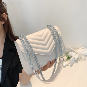 Chic beige quilted square crossbody bag with stylish silver chain and leather strap