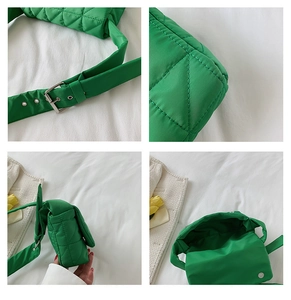 Detail view of green quilted cotton bag showing silver buckle and magnetic closure