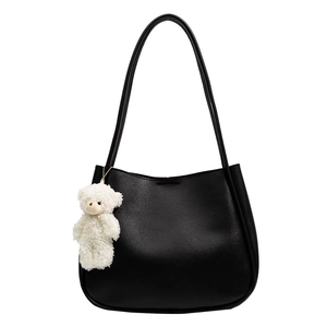 Large capacity black soft leather shoulder bag with cute plush bear charm decoration
