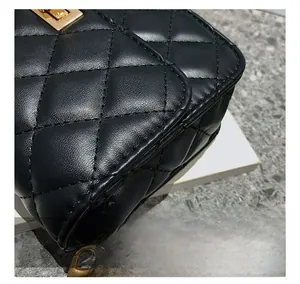 Close-up of diamond quilted stitching and premium black leather texture on bag