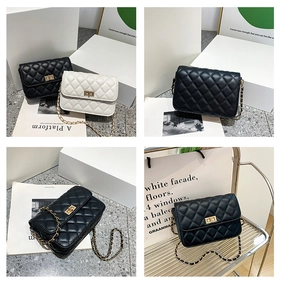 Detail of quilted leather crossbody bag featuring gold metal twist lock and chain strap