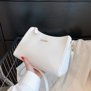 Chic white leather shoulder bag with gold hardware and MS.HUIXIBAG brand logo