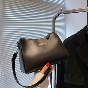 Minimalist black leather underarm bag with gold logo and adjustable shoulder strap