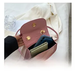 Pink quilted crossbody bag interior capacity showing space for phones and wallet