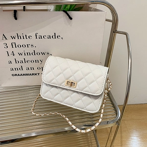 Elegant white quilted chain crossbody bag with gold metal twist lock and woven strap
