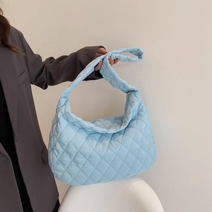 Light blue quilted rhombic shoulder bag with a soft puffy hobo design and wide strap