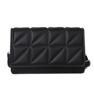 Minimalist black quilted crossbody bag with geometric triangle stitching and silver hardware