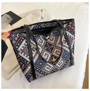 Close-up of colorful ethnic geometric woven pattern and texture on a large tote bag