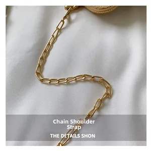 Close-up of polished gold-tone metal chain shoulder strap for vintage style evening handbags