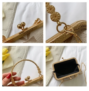 Macro view of vintage gold kiss-lock clasp and embossed floral texture on the evening bag