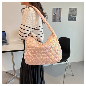 Close-up of holographic pink quilted tote bag showing large capacity and shiny finish