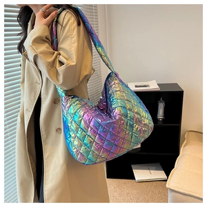 Close-up of holographic quilted cloud bag featuring metallic iris texture and diamond stitching