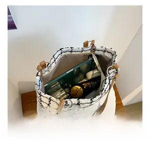 Internal view showing large storage capacity of this checkered tweed tote bag